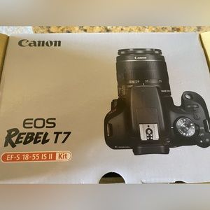 Canon body only camera plus batteries and charger.